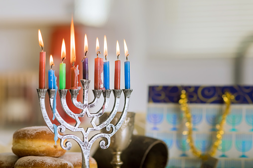 Celebration Hanukkah is based on Judaism tradition of lighting candles in hanukkiah menorah as symbol holiday