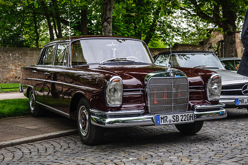 Fulda, Germany - May 9, 2013: maroon Mercedes-Benz 220 SE Limousine retro car
