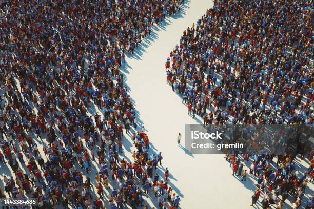 Man Walking In Crowds Of People Stock Photo - Download Image Now - Standing Out From The Crowd, Crowd of People, Individuality