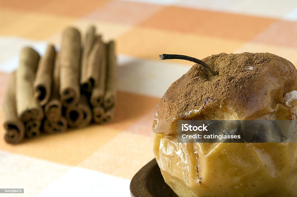 Baked apple with cinnamon Baked apple with cinnamon ground and cinnamon sticks Antioxidant Stock Photo