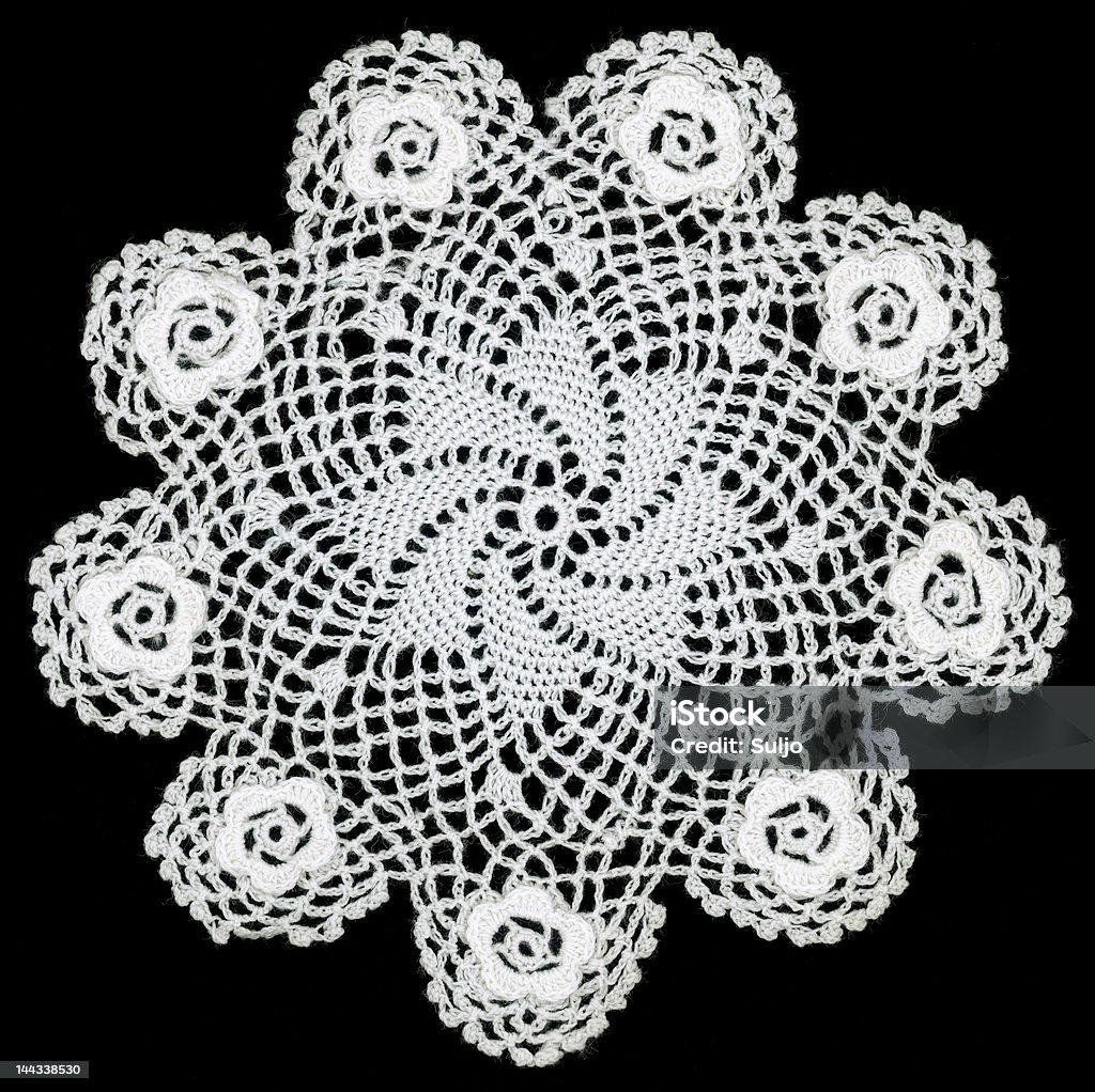 Embroidery Doily Retro lace doily pattern isolated on black background Antique Stock Photo