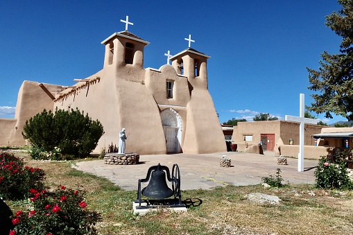 San Francisco de Asia Catholic Mission Church in Taos, New Mexico in the traditional adobe style architecture