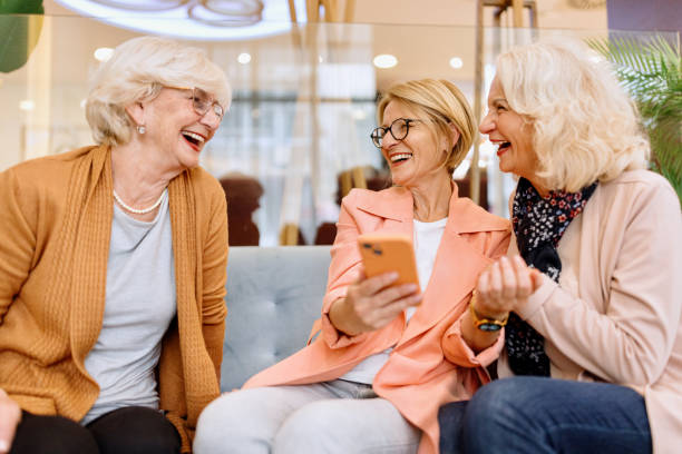 istock Beautiful senior women smiling while using smartphone 1443389557