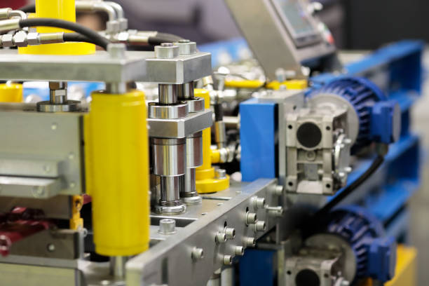 istock metal tile roof roll forming machine closeup 1443391245