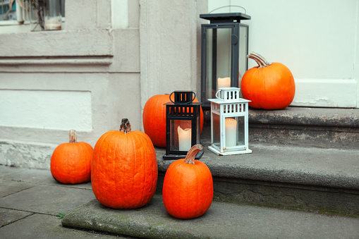 Pumpkins and lamps . Decor for Thanksgiving Day