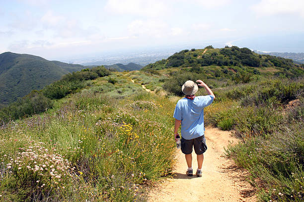 Man hiking on a mountainous path in the Santa Monica Mountains
