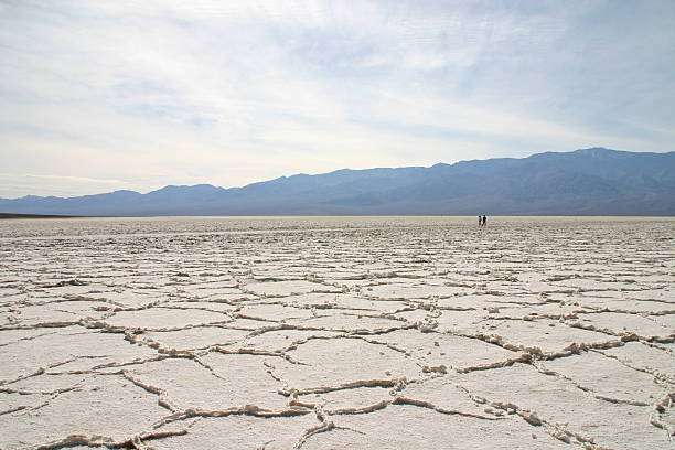 Death Valley Salt Flats – People in the distance stock photo