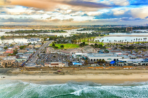 Aerial view of the famous Mission Beach located in San Diego, California shot from an altitude of about 800 feet over the Pacific Ocean during a helicopter photo flight.