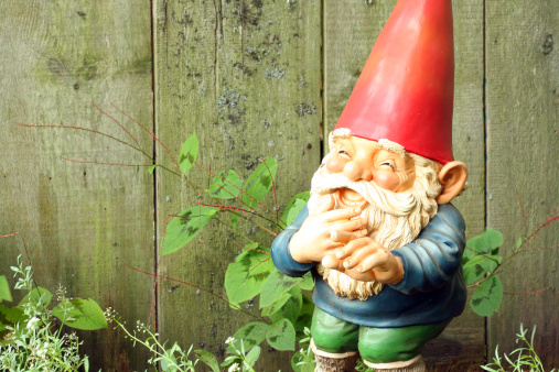 A garden gnome pointing and laughing.
