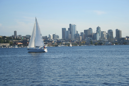 Sailing boat on lake union with Seattle skyline