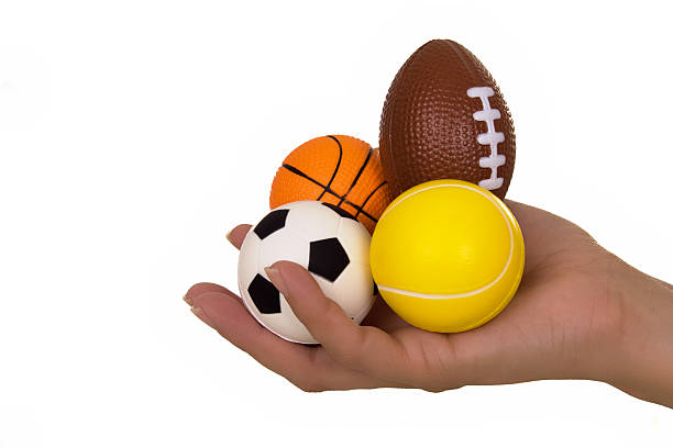 istock Hand holding sport balls 144340031