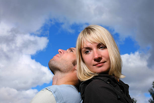 istock Young couple relaxing under the sky 144340155