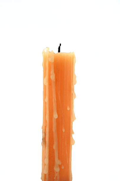 candle yellow a yellow candle standing with a white background candle wax stock pictures, royalty-free photos & images
