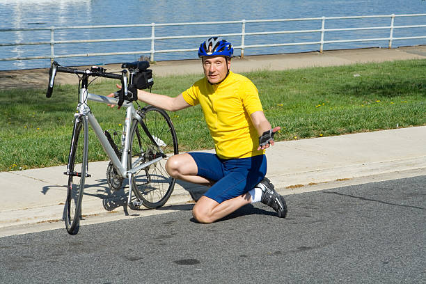 Senior in biking clothing shrugging - See lightbox for more