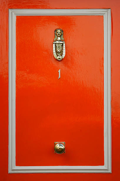 Red doors with door knocker stock photo