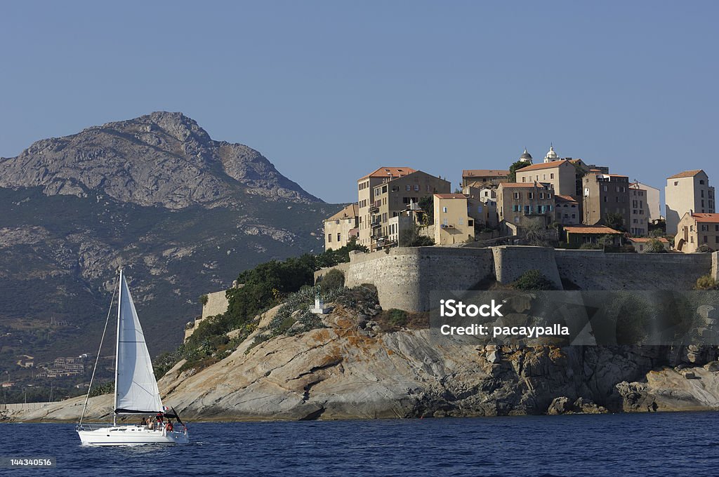 Calvi village on the sea with sailing boat France- Corsica - Mediterranean - Calvi Calvi Stock Photo