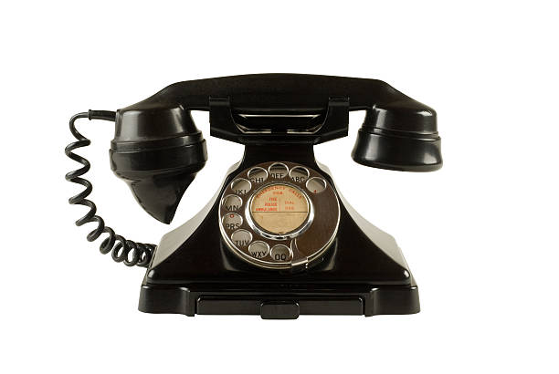 Antique dial telephone isolated on white with clipping path