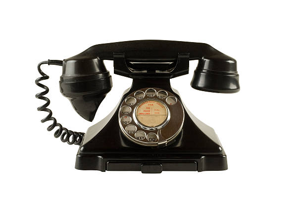 Antique dial telephone isolated on white with clipping path Old 1950s bakelite dial telephone isolated on white with clipping path. bakelite stock pictures, royalty-free photos & images