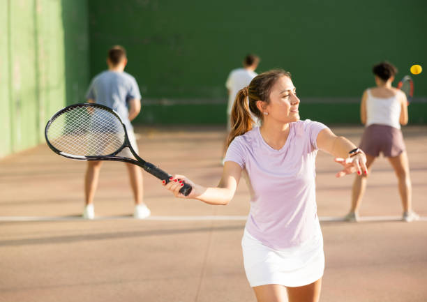 istock Woman pelota player hitting ball with racket 1443408466