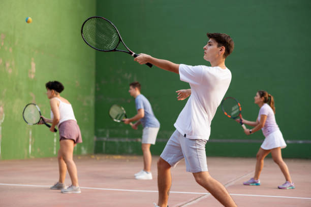 istock Young male pelota player hitting ball with racket 1443408603
