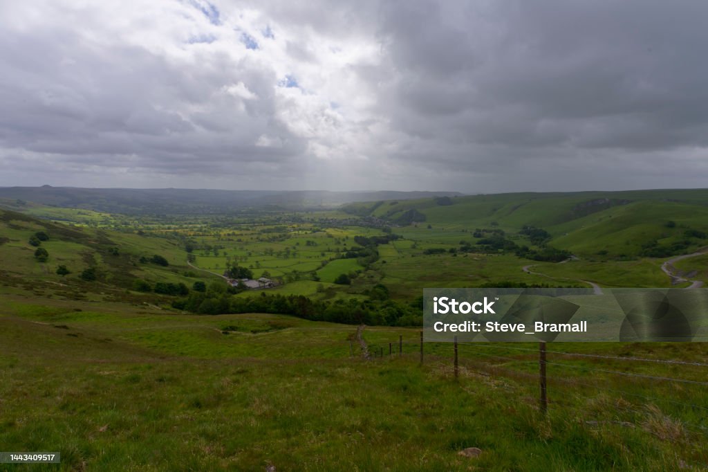 Dark and misty day on Mam Tor in Derbyshire. Dark, misty summer morning on Mam Tor near Castleton in the High Peak of Derbyshire Rain Stock Photo