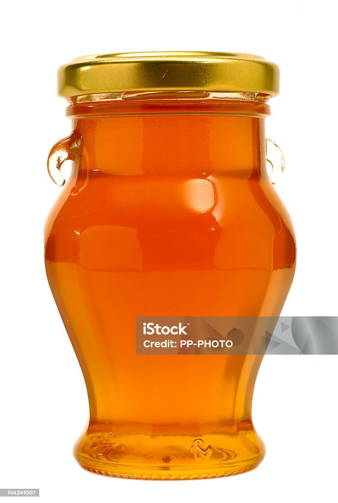 Pot with honey Glass pot with honey isolated on white background Cut Out Stock Photo