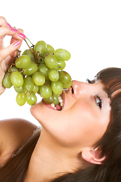 istock Beautiful young woman with green grape 144341274