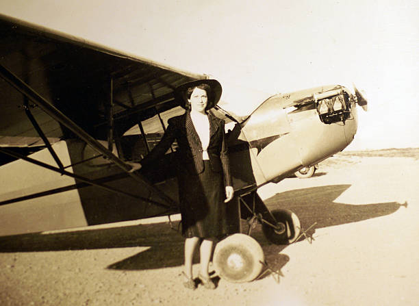 World War II era bomber flying with bomb bay open
