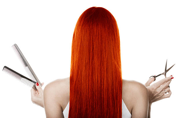Back view of woman with long red hair with combs & scissors Red hair and hairdresser's tools dyed red hair photos stock pictures, royalty-free photos & images