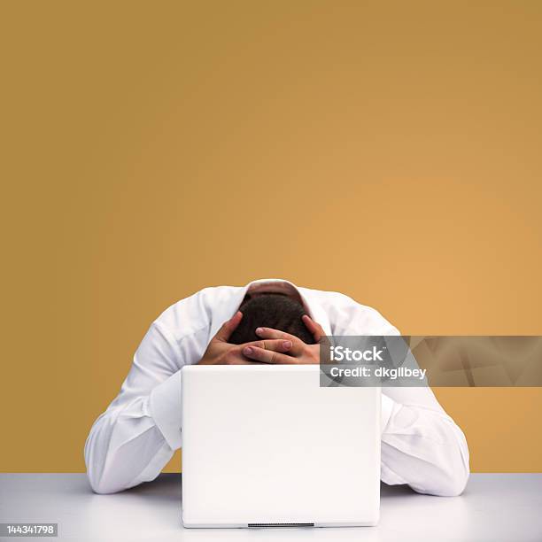 A Man Hanging Head Over Laptop Stock Photo - Download Image Now - Adult, Adversity, Bad News