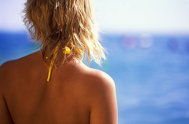 Girl's head and shoulders, back view stock photo