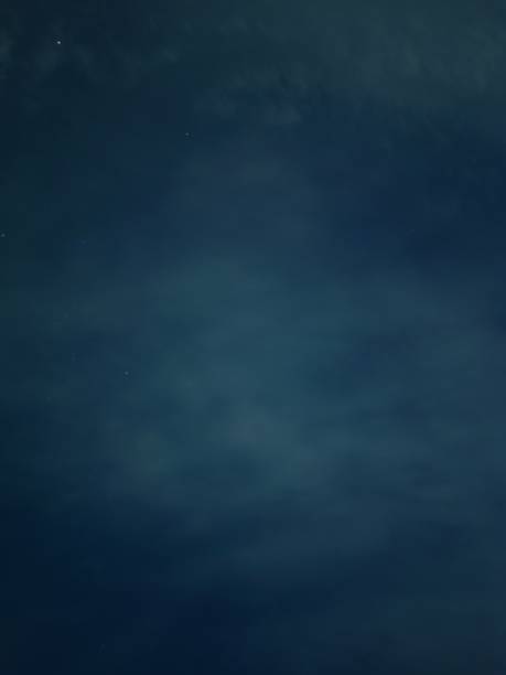 istock Cloudy night skies with green clouds 1443421119