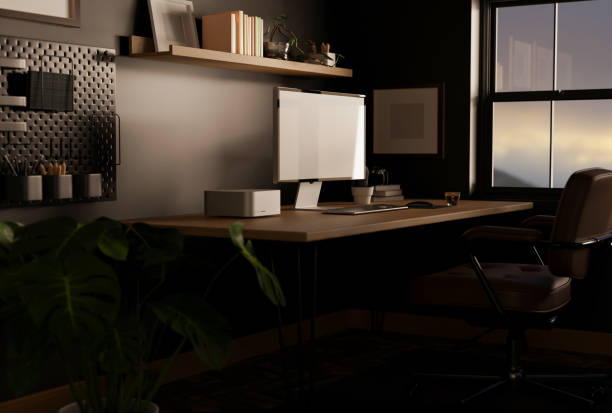 istock Stylish dark home office with computer mockup on table against the black wall. trendy workspace 1443421813