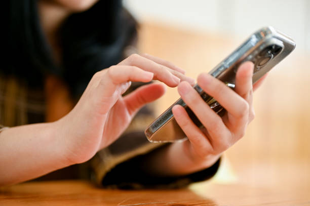 istock A woman using her smartphone, chatting with her friends, using social media or application. 1443421844