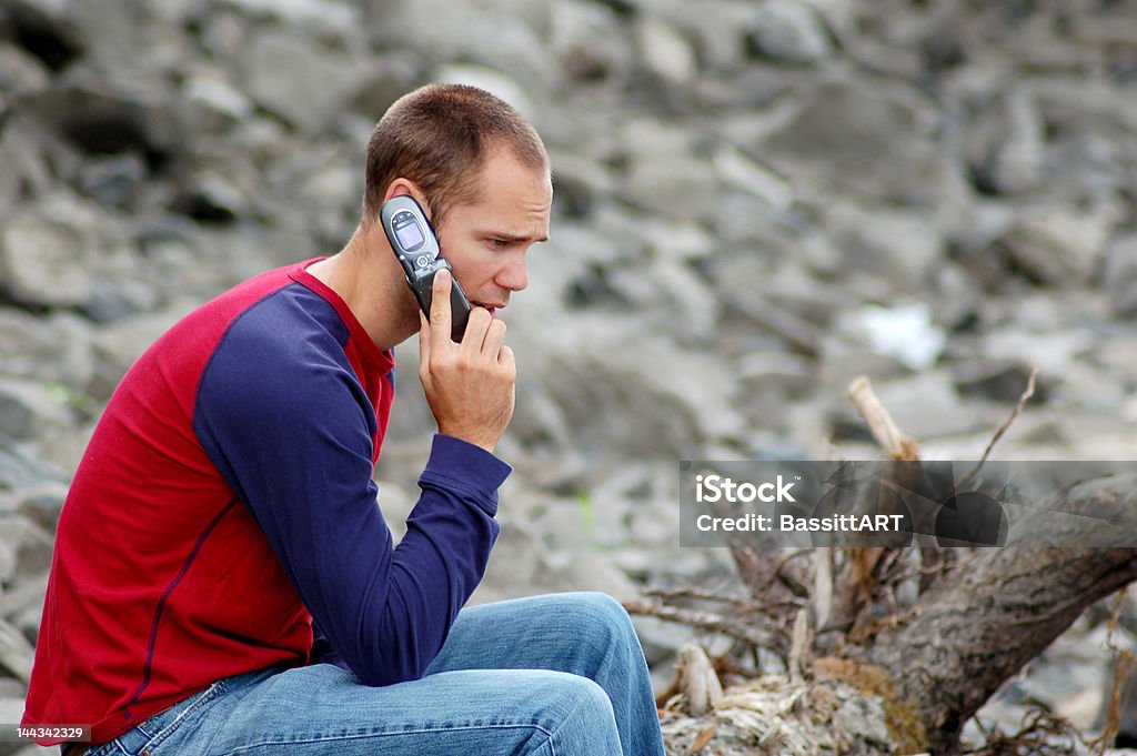 Serious Conversation A man having a serious conversation on the phone Adolescence Stock Photo