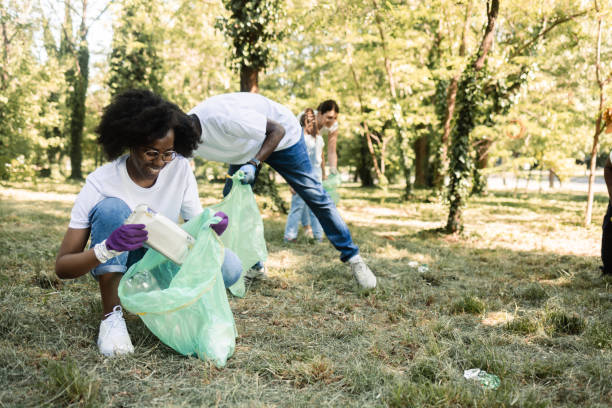 istock Group of young environmentalists collecting garbage at their park 1443424980