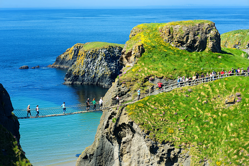 Carrick-a-Rede Rope Bridge, famous rope bridge near Ballintoy in County Antrim, linking the mainland to the tiny island of Carrickarede. One of the most iconic tourist attractions in Nothern Ireland.