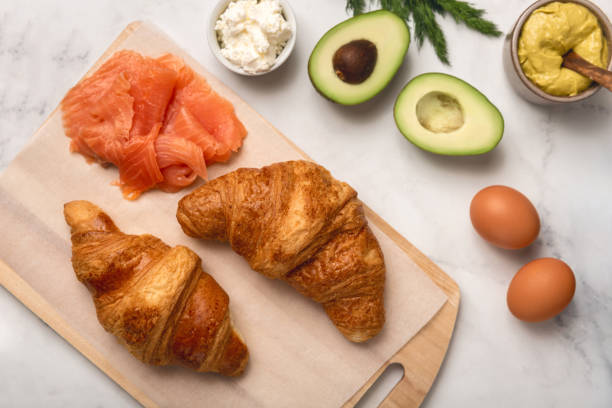 istock Fresh morning croissants on table. Top view. 1443425743
