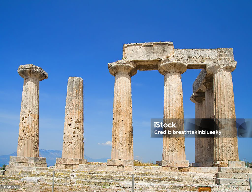 Apollo Temple Apollo Temple in Corinth, Greece. Perfect blue sky.  Ancient Stock Photo