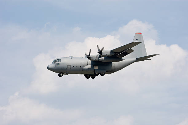 A C-130 military transport plane is on final to land during an airshow in Japan.