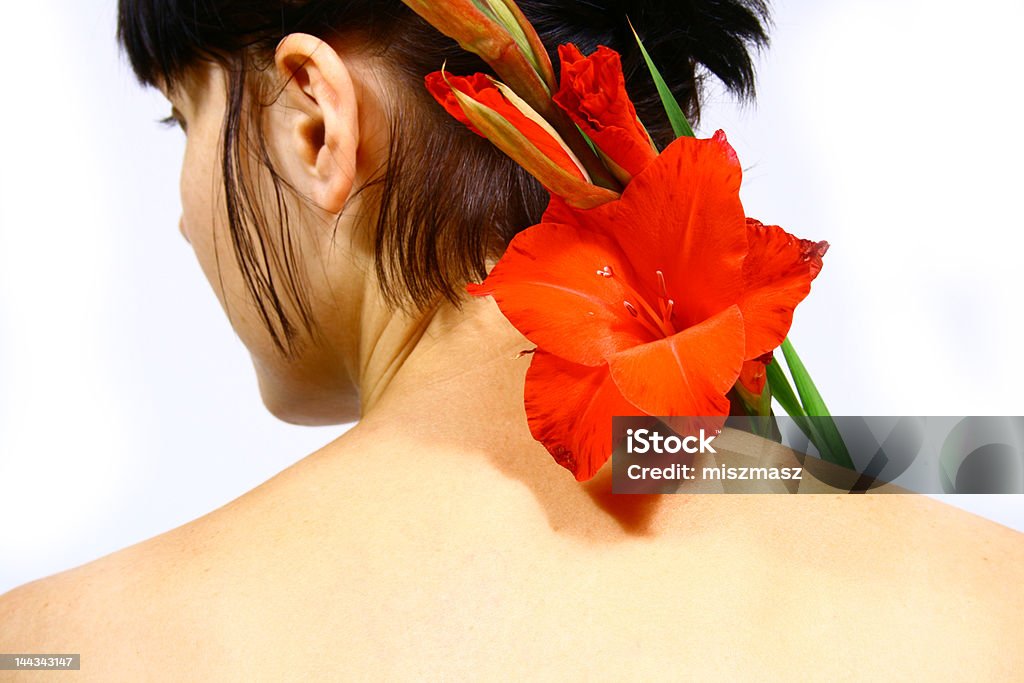 Mujer con flor - Foto de stock de Gladiolo libre de derechos