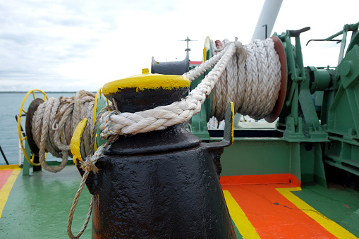 Mooring crane ropes on marine boat drums. Deck mooring mechanism at the fore of the tanker.