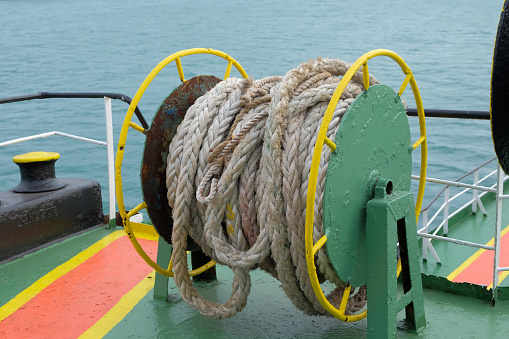 Mooring crane ropes on marine boat drums. Deck mooring mechanism at the fore of the tanker.