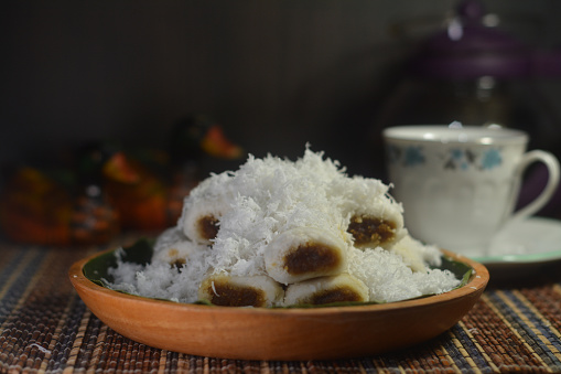 Kue putu or putu bambu is an Indonesian traditional snack. It is made from rice flour   and filled with palm sugar, steamed in bamboo tubes, and served with  coconut flakes.