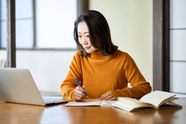 istock Asian woman studying for qualifications 1443435972