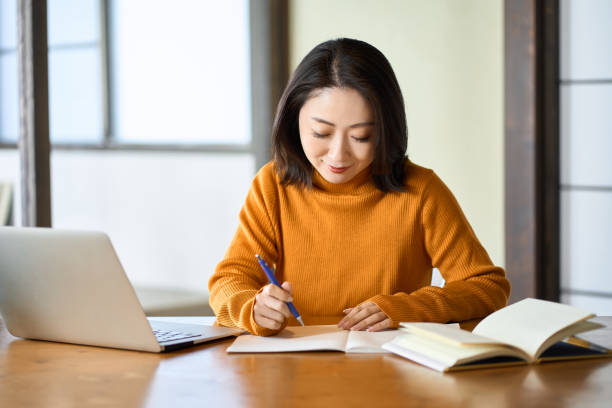 istock Asian woman studying for qualifications 1443436000
