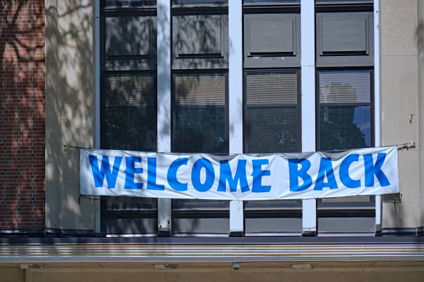 istock Sign on high school building welcoming students back in September 1443436060