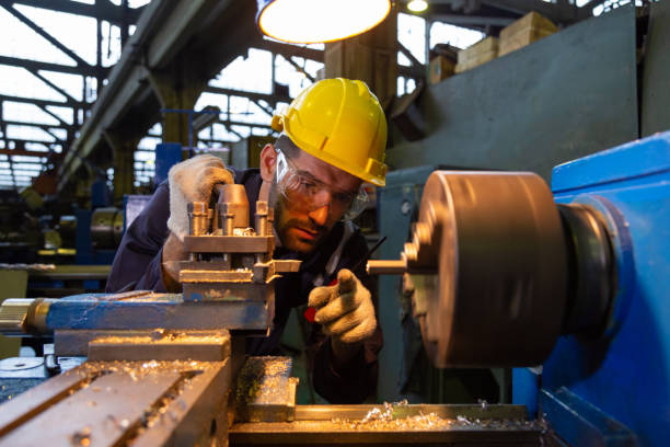 istock CNC turning engineering, workers, people, quality control, maintenance, factory inspection 1443436095