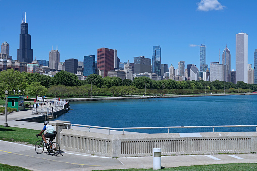 Chicago, USA - August 2022:  Lakefront recreational trail with Grant Park and downtown skyline