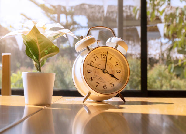 istock Alarm clock on the table, afternoon 4.00 pm 1443438523